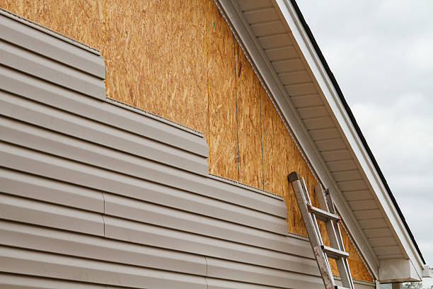 Professional Emergency Siding Repair technician working in Lowell, NC